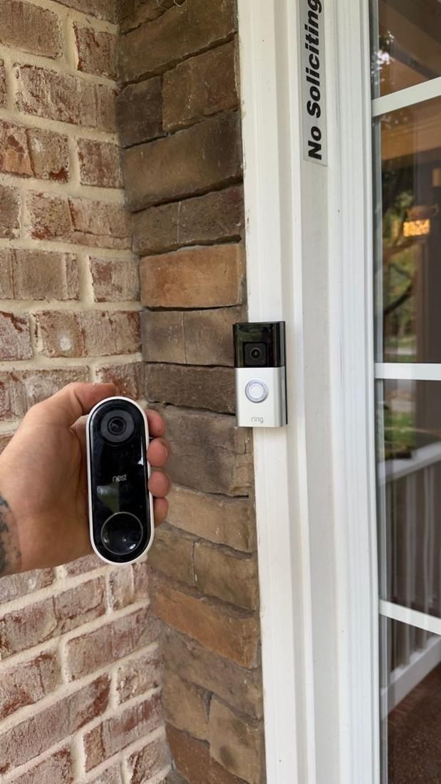 Video doorbell installed beside a front door